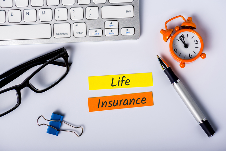 Life insurance - text on insurer workplace. Healthcare, accident and medical insurance concept.